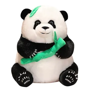 Cute giant panda plush toy holding green bamboo stalk, soft stuffed animal for kids.