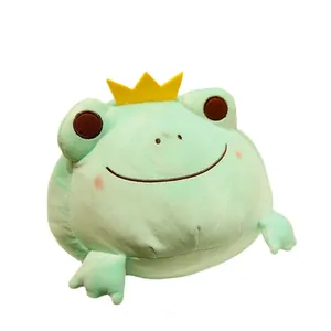 Adorable green plush frog toy wearing a golden crown, soft stuffed animal pillow