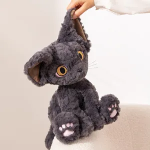 Charcoal grey Devon Rex cat plush toy with soft curly fur and large expressive yellow eyes