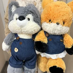 Original plush fox and husky toys wearing denim overalls for forest-themed play