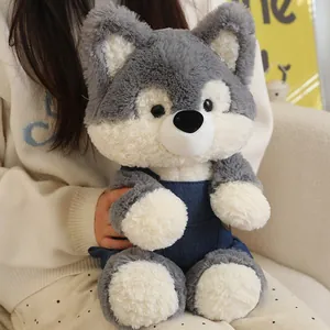 Cute grey wolf husky plush toy wearing denim overalls, soft stuffed animal gift for girls.