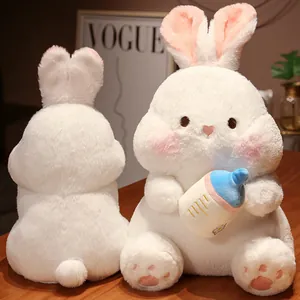 Adorable soft white plush bunny rabbit doll holding a blue baby bottle accessory