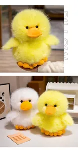 Close-up detail of fluffy yellow and white duck plush toys with soft faux fur texture