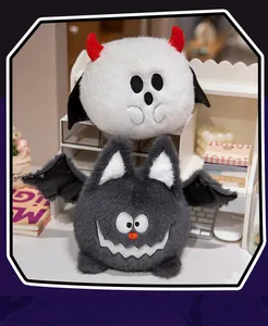 Pair of cute Halloween plush toys featuring a white ghost and a grey bat with soft fur.