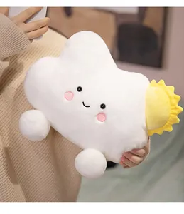 Soft white cloud plush pillow with a sun detail and smiling face