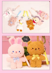 Detailed view of cute pink rabbit and brown bear plush keychains featuring bow ties