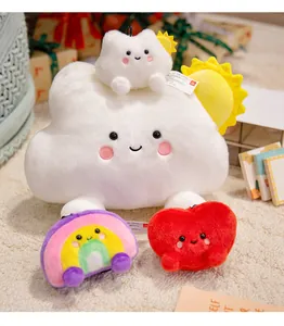 Detailed view of cute plush cloud, rainbow, and heart toys set on soft carpet.
