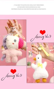 Detailed view of cute plush unicorn and white duck keychains with soft texture for bags.