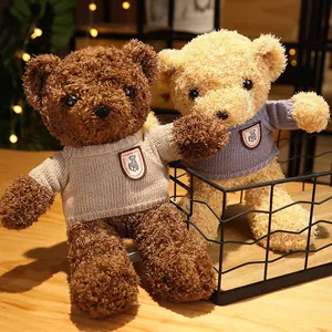 Two small cute teddy bears wearing knitted sweaters perfect for Valentine's Day gifts