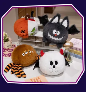 Detailed group view of colorful plush Halloween toys featuring a bat, spider, and pumpkin