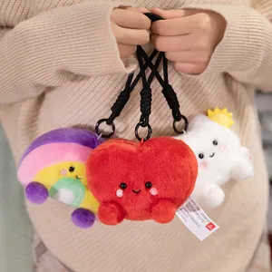 Cute plush character keychains with rainbow heart and cloud designs for accessories.