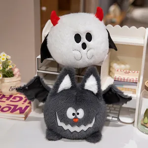 Funny Halloween plush ghost and bat dolls displayed on a desk for gift inspiration