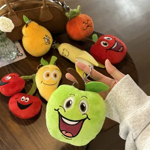 Giocattoli colorati in peluche a forma di frutta per animali con simpatici visi