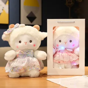 Soft white plush sheep doll wearing a colorful floral dress with a premium gift bag