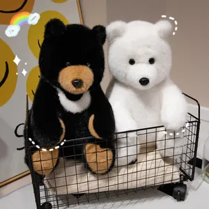 Realistische Plüschtiere Schwarzbär und Eisbär in einem schwarzen Drahtkorb sitzend