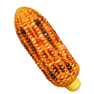 Realistic roasted corn plush pillow toy with charred kernel details on white background