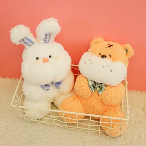 Two cute plush bunny and tiger stuffed animal toys sitting in a white wire basket