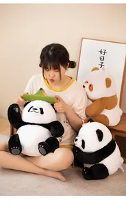 Lifestyle shot of cute panda plushies being held by a female model in a cozy room.