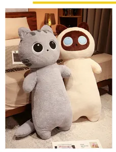Two large grey and Siamese cat plush body pillows displayed in a cozy bedroom setting