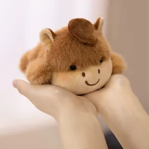 Adorable small brown capybara plush fridge magnet toy being held in palms for home decor