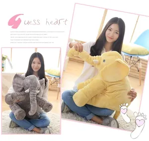 Large soft plush elephant stuffed animal pillow for baby comfort and sleep, shown with a model