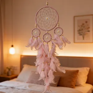 Handmade four-ring pink dreamcatcher with soft feathers for bedroom wall decor
