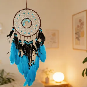 Close-up detail of a tree of life dreamcatcher with vibrant blue feathers and turquoise beads