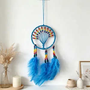 Handmade blue dream catcher with rainbow beads and soft feathers for wall decor