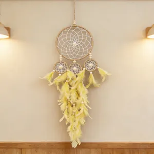 Handmade gothic wall hanging dreamcatcher featuring four rings, yellow feathers and wood beads