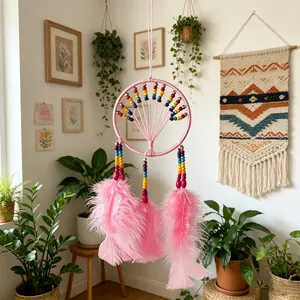 Handmade dreamcatcher with pink feathers and rainbow beads for boho wall decor.
