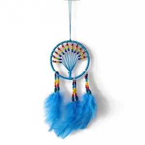 Detailed view of the handmade blue dreamcatcher featuring colorful beads and soft feathers