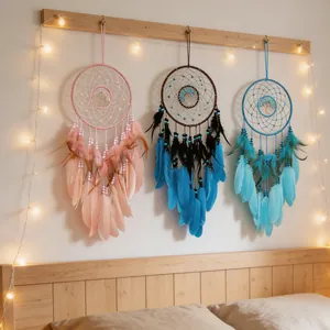 Decorative wall hanging featuring three colorful tree of life dreamcatchers with soft feathers.
