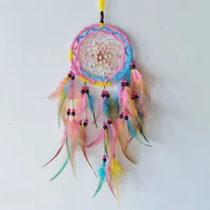 Handmade colorful dream catcher with vibrant feathers for bohemian home wall decoration