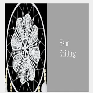 Detailed view of hand-knitted Nordic dream catcher with white floral pattern