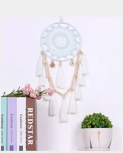 Handmade Nordic style dreamcatcher wall hanging with white tassels and wooden beads