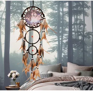 Vintage handmade dreamcatcher with wolf print and feathers for bedroom wall decor