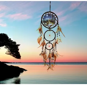 Vintage handmade Indian style dreamcatcher featuring wolf design with feathers and beads