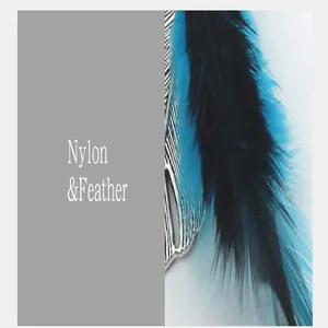 Macro detail of vibrant blue and black feathers on a nylon dreamcatcher accessory.