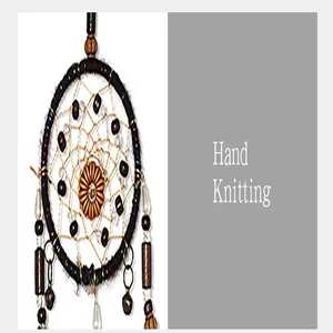 Detailed view of hand-knitted vintage Indian style dreamcatcher with beads and bells