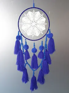 Detailed view of a blue petal tassel dreamcatcher with white crochet and wood beads