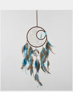 Bohemian tree of life dreamcatcher with vibrant blue and brown feathers