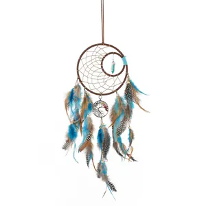 Handcrafted vintage Tree of Life dream catcher with blue and brown natural feathers