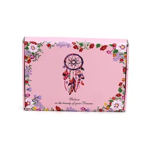 Caja de regalo rosa con diseño de atrapasueños, borde floral y una cita inspiradora