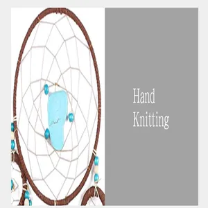 Detail of a handmade dream catcher with turquoise stone and blue beads on woven web