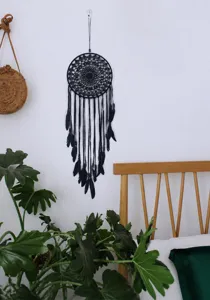 Elegant black dreamcatcher wall hanging with feathers for home bedroom wall decor.