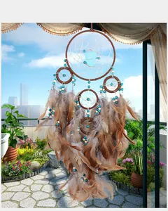 Handmade brown feather dreamcatcher wall hanging with turquoise beads decoration
