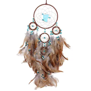 Handmade Indian style dreamcatcher with brown feathers and turquoise beads decor