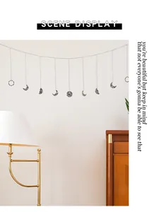 Detail view of Bohemian iron moon phase wall hanging in a lifestyle home setting
