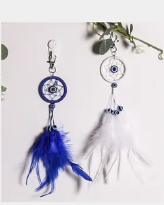 Portachiavi acchiappasogni fatto a mano con occhio del male e piume blu e bianche, boho