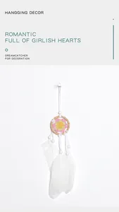 Macro view of minimalist white dreamcatcher pendant with handmade flower heart detail